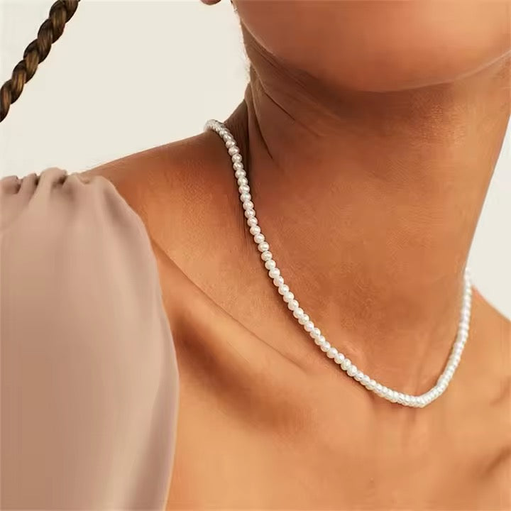 Collana con perline bianche in acciaio inossidabile